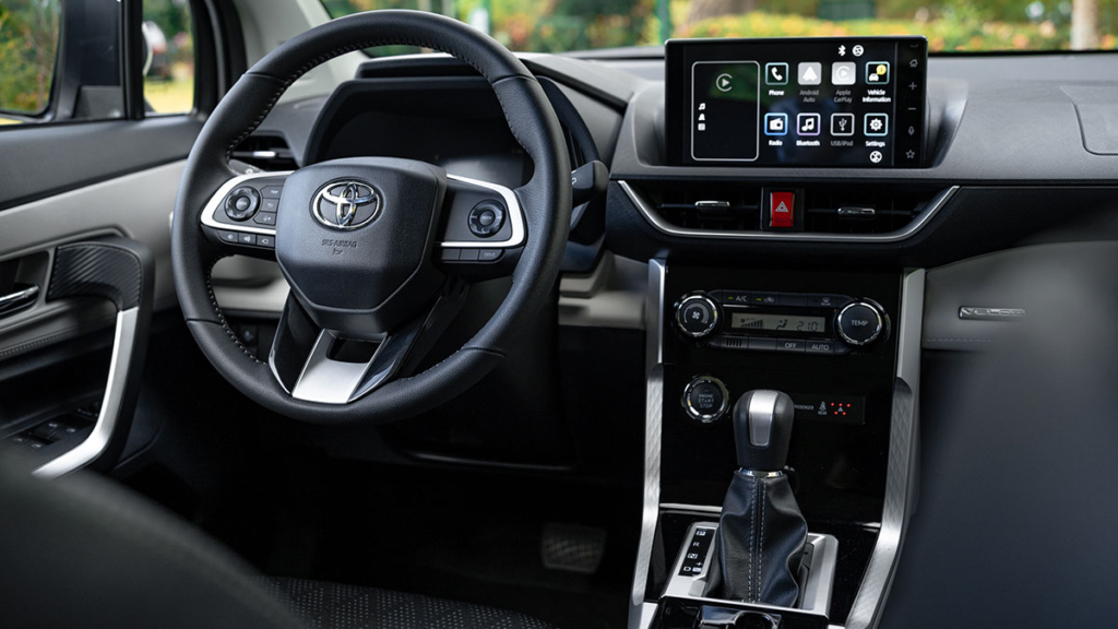 Interior view on car steering wheel and multimedia player with android auto and apple car play.