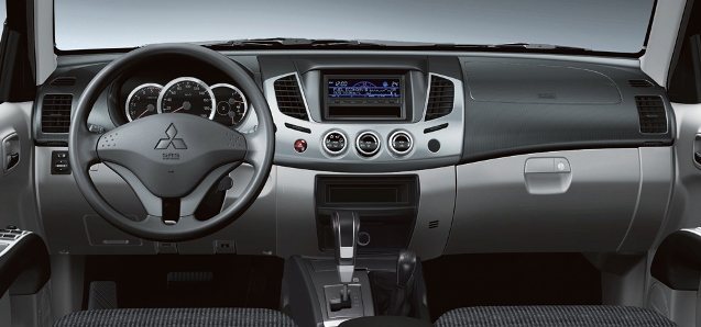 Interior look of Mitsubishi Triton 2013. View of dash panel and MID